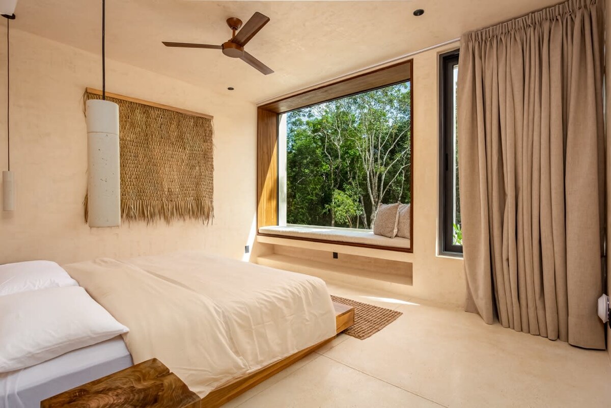Second bedroom with comfortable bedding and tropical decor at Luxury Jungle VIBE